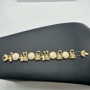Gold tone and enamel volleyball charm bracelet
